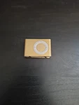 Apple Ipod Shuffle A1204, Gold Used. Price: $18.99.