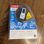 Sandisk Sansa M230 MP3 Music Player 512MB Blue & White - Brand New Sealed!. Price: $45.00.