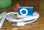 Apple Ipod Shuffle 1GB 2ND Generation MA949LL/A Turquoise New In Box Open. Price: $59.99.