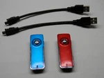 Coby MP550-1G 1GB Micro Clip MP3 Player Used Qty. (2) Red/blue. Price: $20.00.