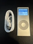 Apple Ipod Nano 2ND Generation Silver (4 Gb) Bundle - See Pictures Used. Price: $39.99.