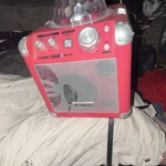 Idance Cube BC100 Bluetooth Karaoke Player Red With Party Light Used. Price: $25.00.