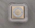 New Apple Ipod Shuffle 4TH Gen Gold 2GB MP3 Music Player Model A1373. Price: $97.50.