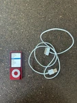 Apple Ipod Nano 5TH Generation Red (8GB) Bundle, Music Loaded Used. Price: $60.00.
