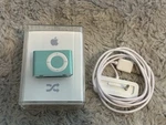 Apple Ipod Shuffle 2ND Generation With Dock & Box In Blue Green Model A1204 1GB Used. Price: $44.44.