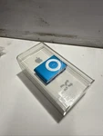 Apple Ipod Shuffle 2ND Generation 1GB Blue Brand New PA949LL/A Collectors Sealed. Price: $75.00.