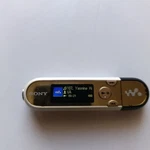Sony Walkman Digital Music Player NW-E042 2GB White Gold Black Used. Price: $65.00.