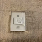 Apple MB225LL/A 1GB 2ND Gen Ipod Shuffle (silver) - Sealed/never Opened New. Price: $45.00.