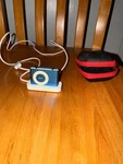 Apple Ipod Shuffle 2ND Generation Blue With Charging Dock And Case Used. Price: $24.99.