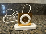 Authentic Apple Ipod Shuffle 4TH Generation 2 Gb Orange Used. Price: $74.90.